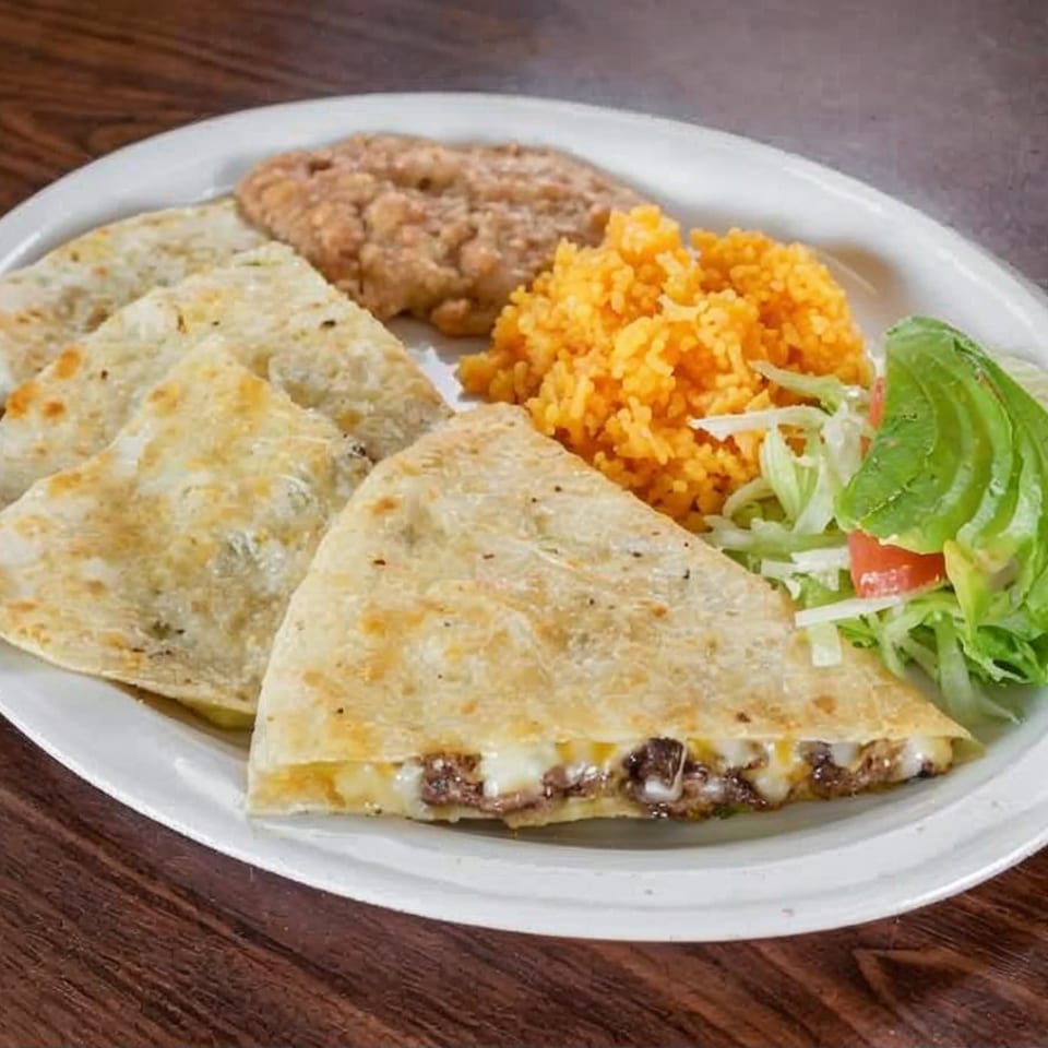 La Perla Tapatia Goshen's quesadillas with rice, refried beans, and a side salad with avocado.